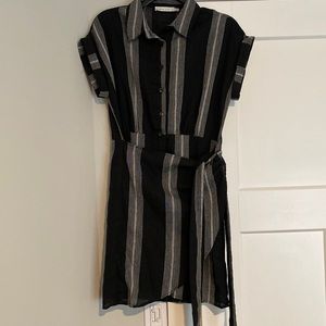 Like new, black and white short wrap dress.